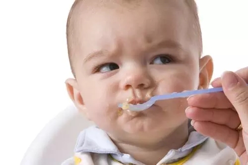 baby-boy-being-fed-spoon
